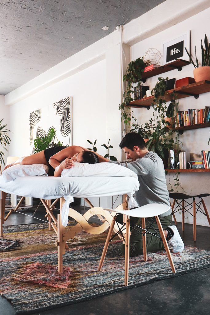 Ryan Caputi with a client during a Rolfing session in the studio